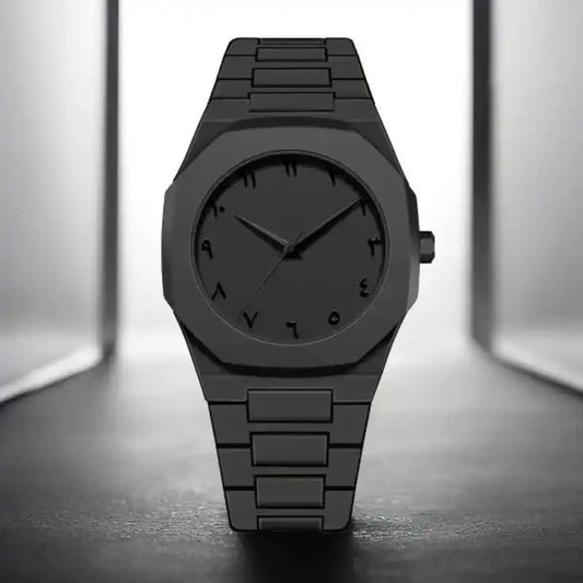 Black wristwatch on a reflective surface with a neutral background
