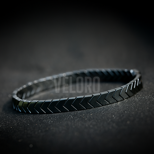 Black textured bracelet on a dark background with 'VELORO' branding.