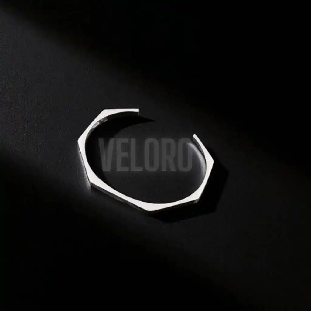 hexagonal geomatric bangle Metallic  on a black background with 'VELORO' branding.